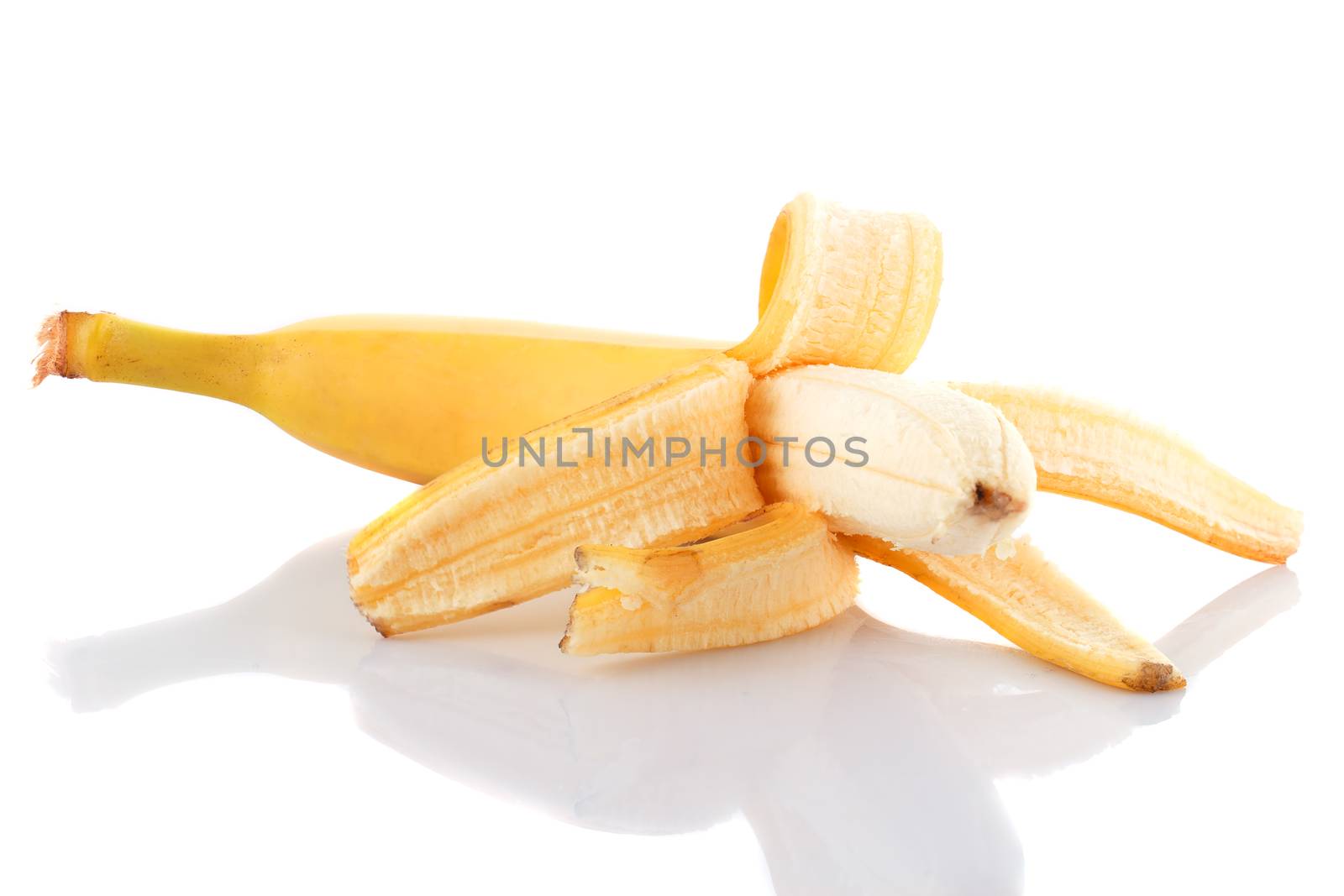 Half peeled ripe banana by baronvsp