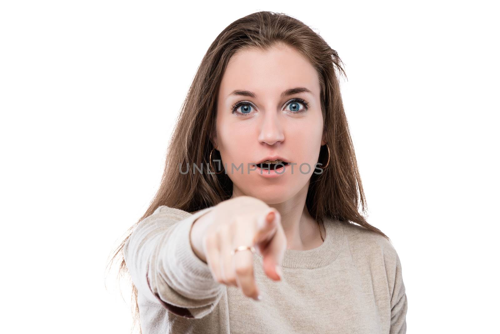 emotional beautiful girl shows a finger at you, portrait is isolated