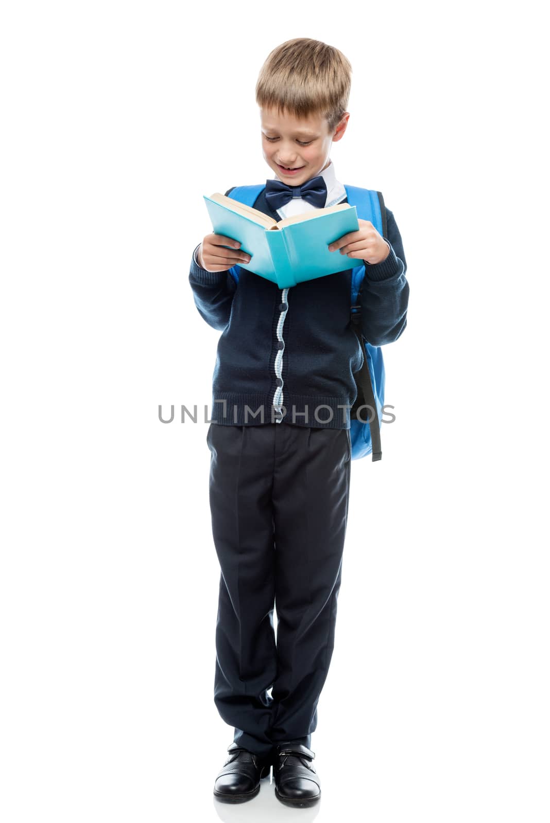 vertical portrait of a schoolboy with a full length textbook iso by kosmsos111