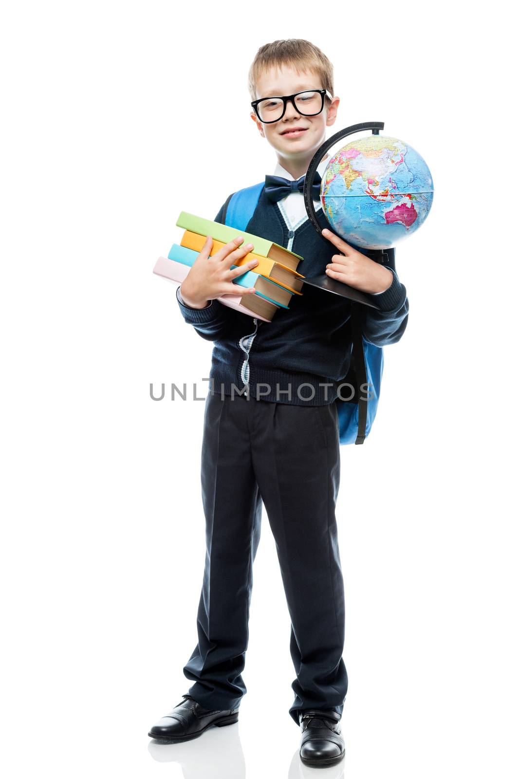 8-year-old schoolboy with a globe and books on a white backgroun by kosmsos111