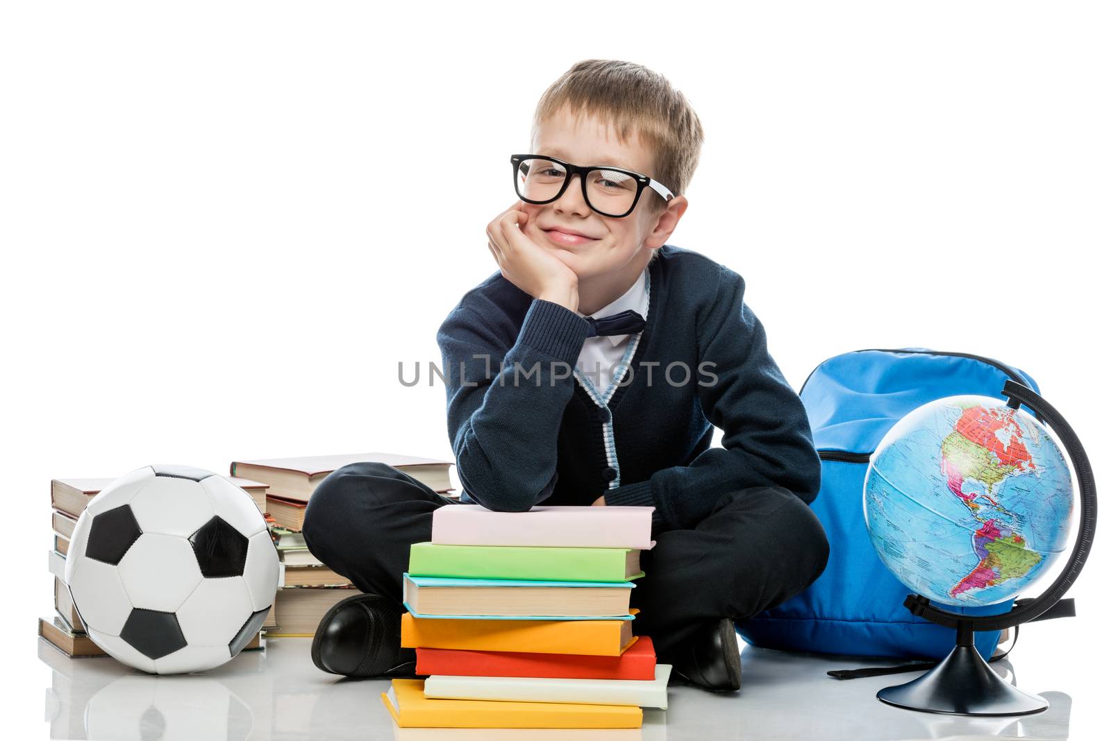 boy in glasses posing while sitting on white background