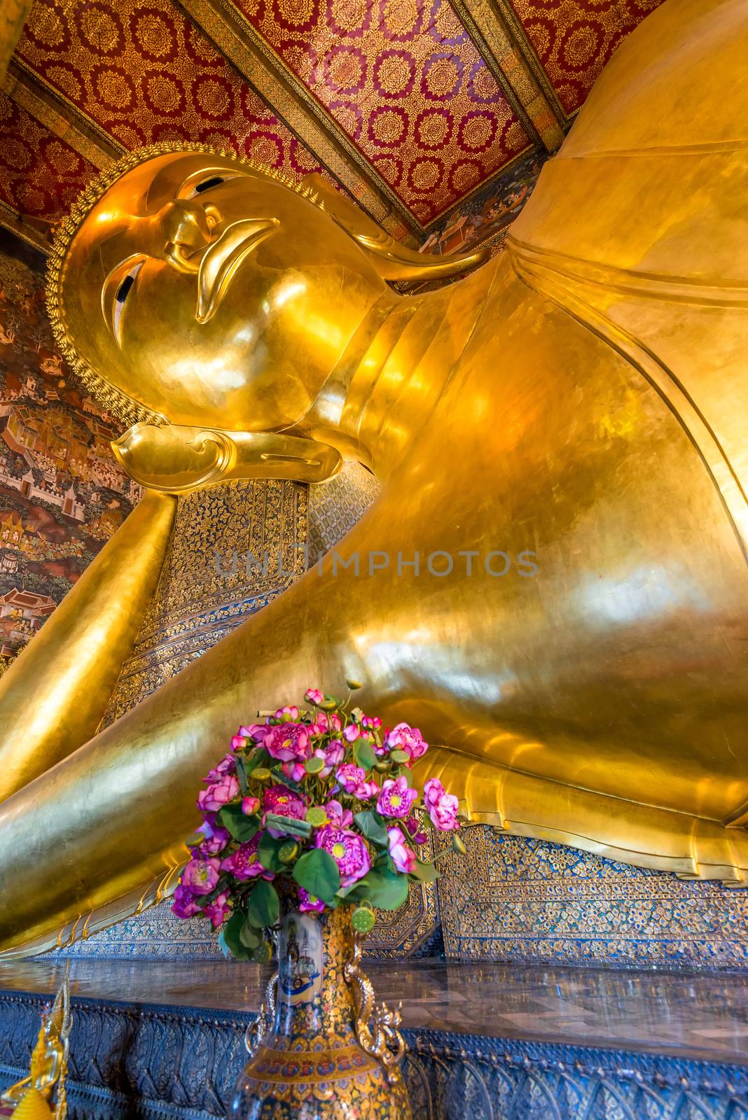 portrait of a Buddha statue in the Temple of the reclining Buddha in Thailand, Bangkok