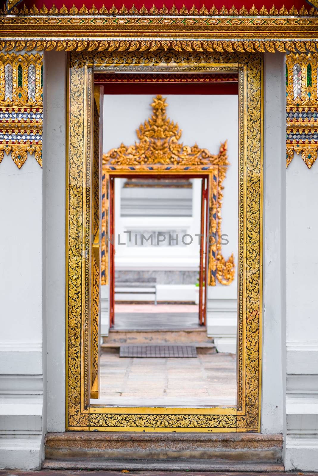 white temple wall and beautiful rich finish close-up, entrance to the temple, Bangkok, Thailand