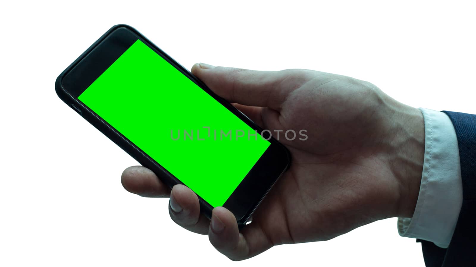 Isolated businessman hand with black smartphone. Green screen