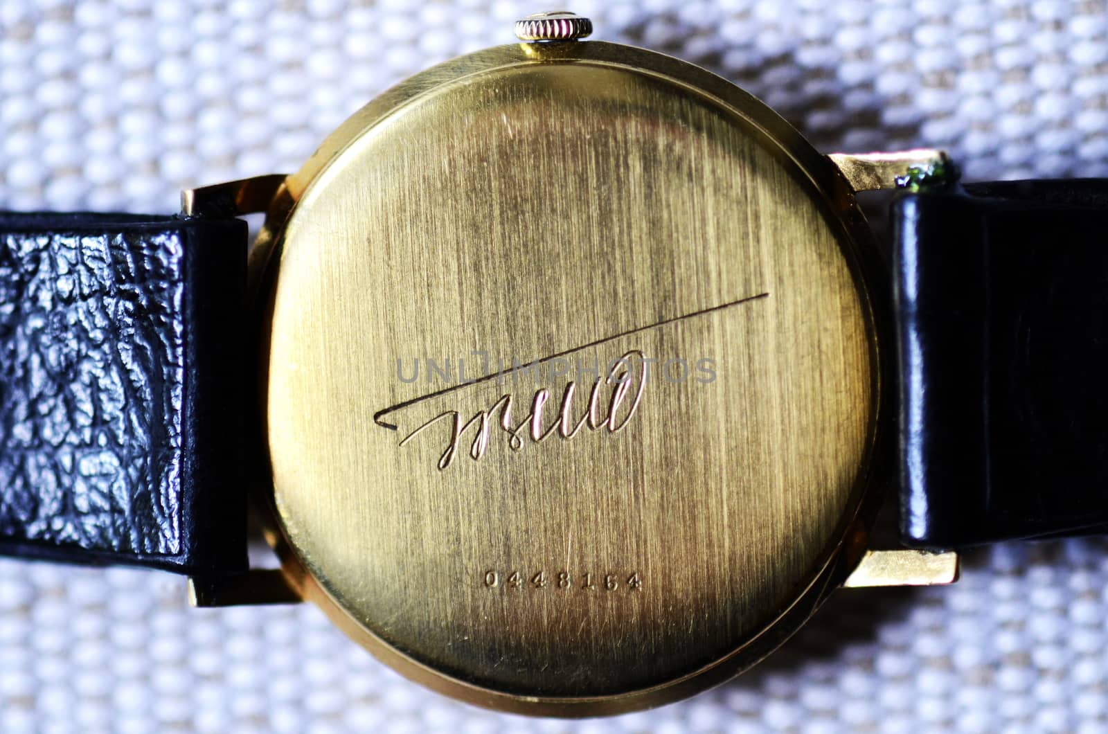 Back of the hand golden clock with Tito's signature