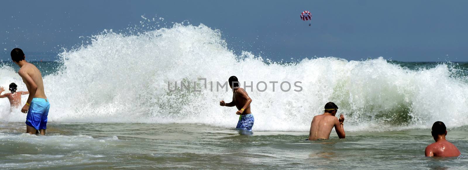 Waves on the beach on sunny summer day