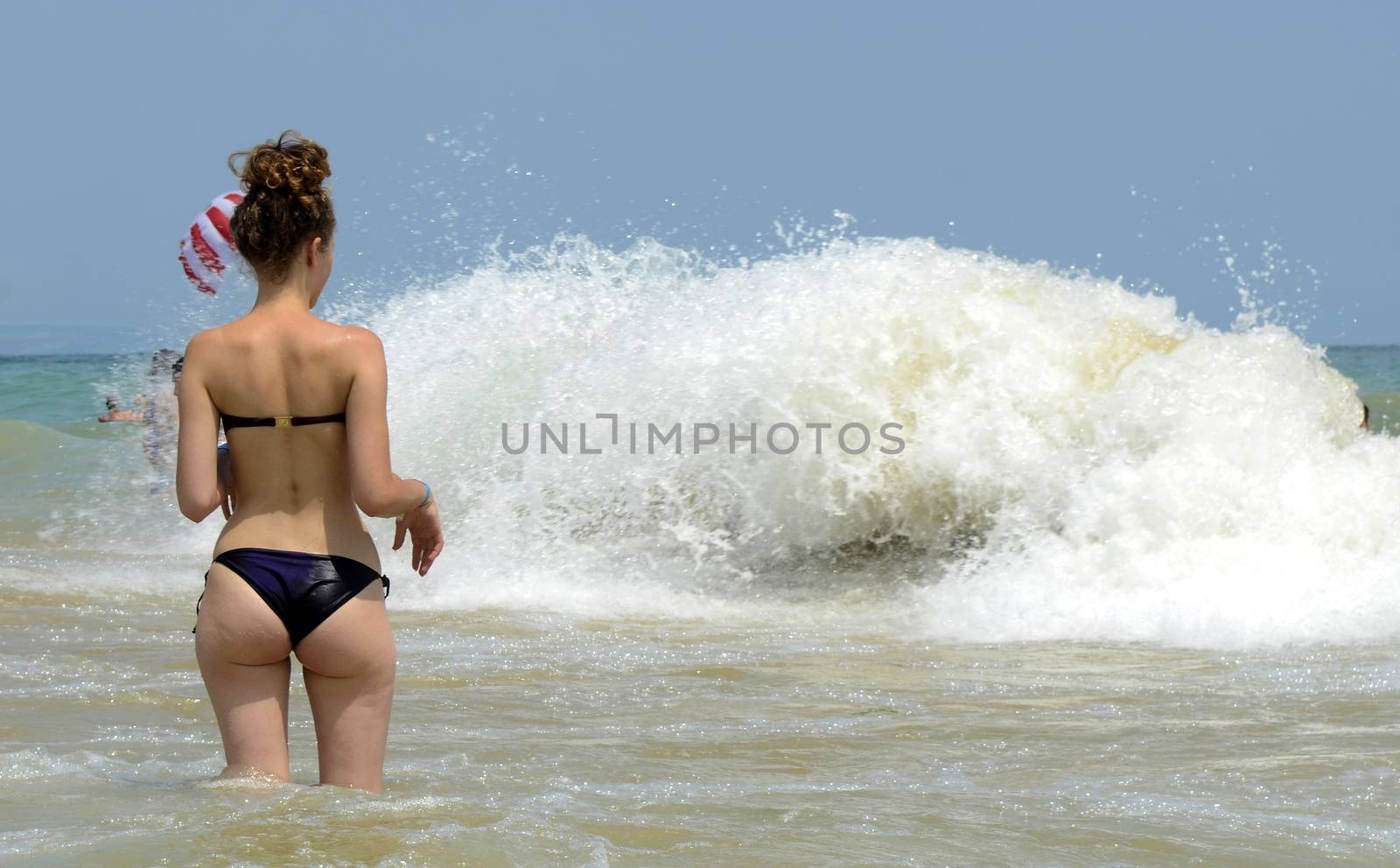 Waves on the beach on sunny summer day