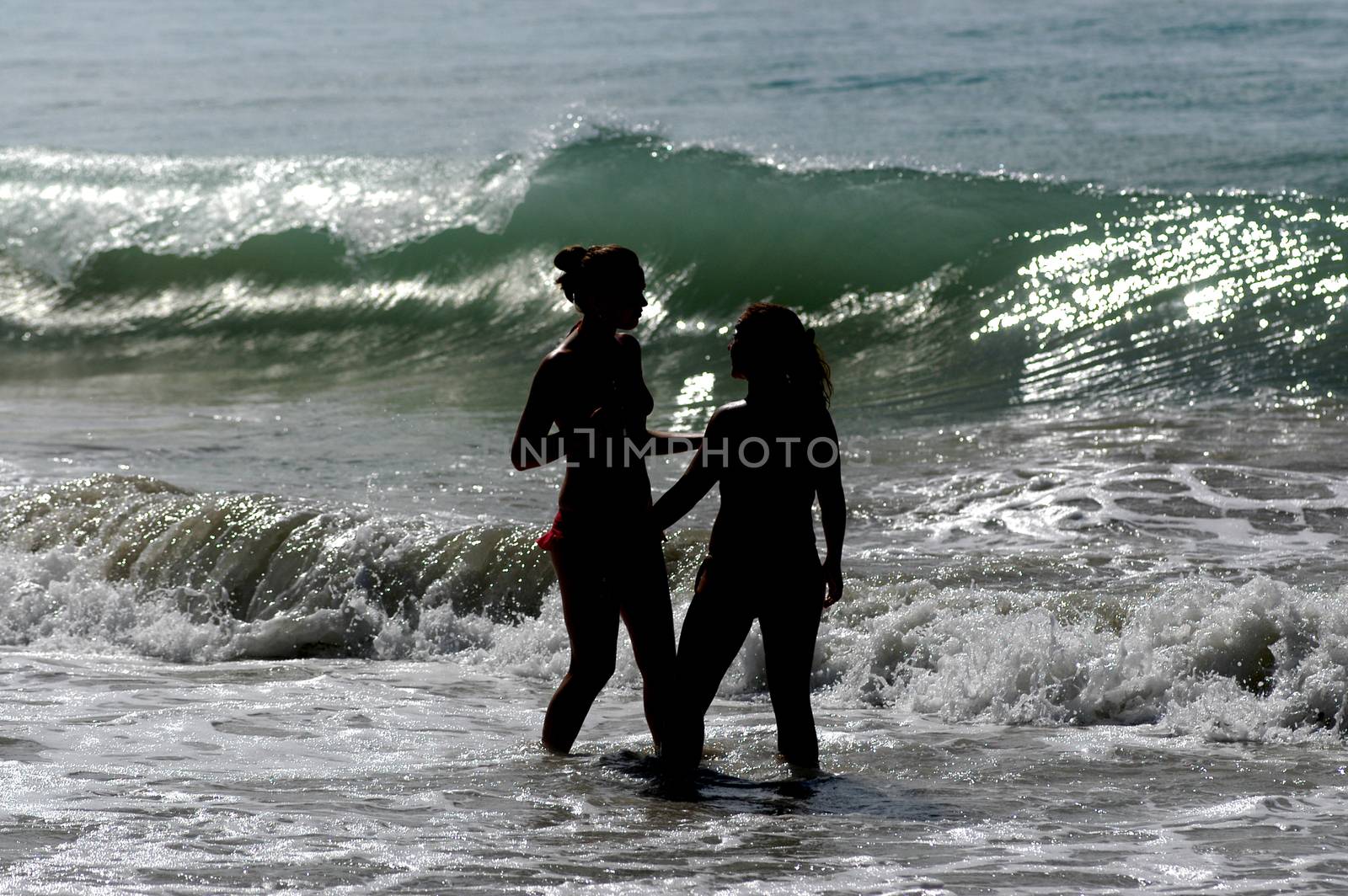 Waves on the beach on sunny summer day