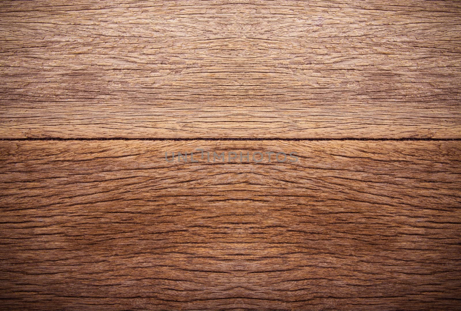 Milk bottle on brown wooden background. Top view with copy space.