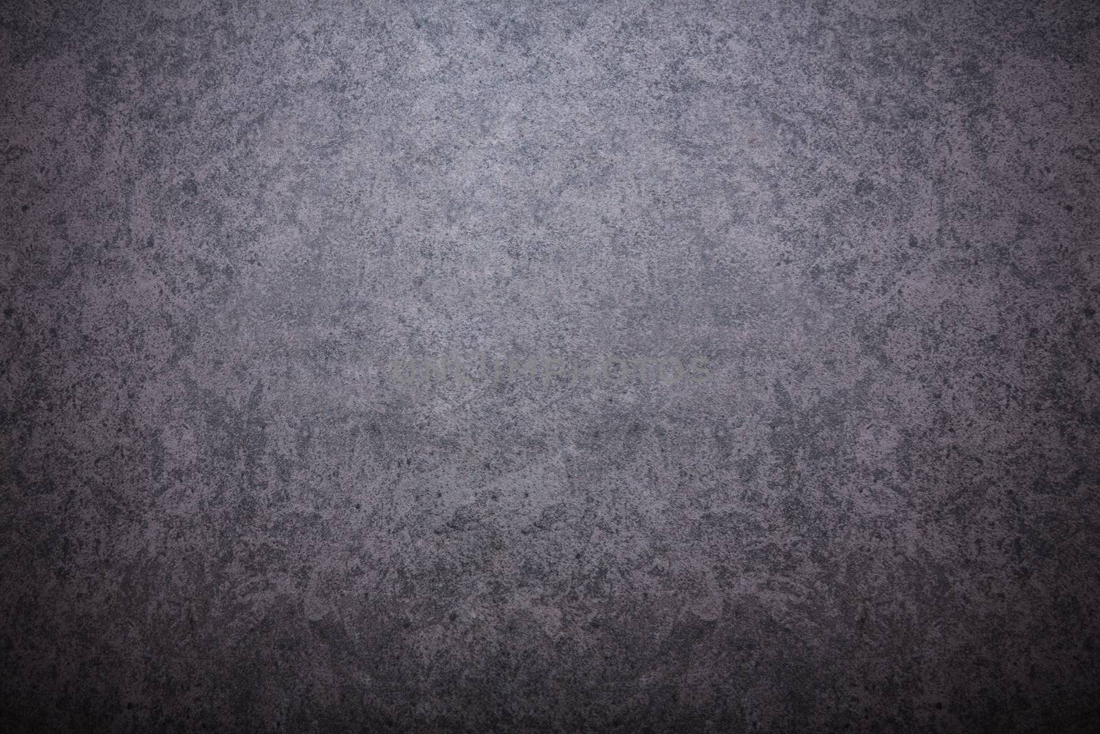 Grey textured concrete wall. Dark edges