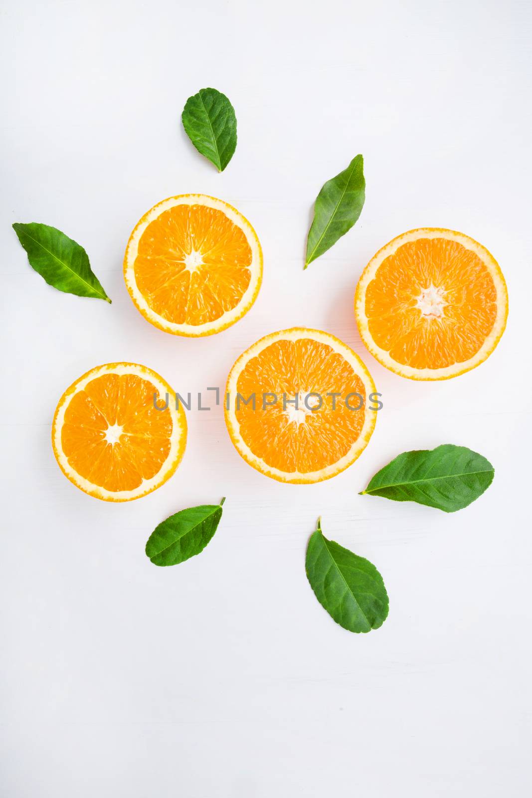 Fresh orange citrus fruit on white background. Top view by Bowonpat