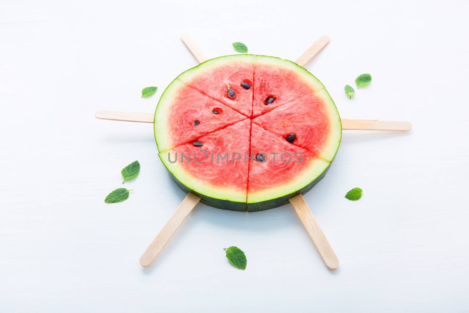 Fresh and sweet watermelon slice popsicles on white background