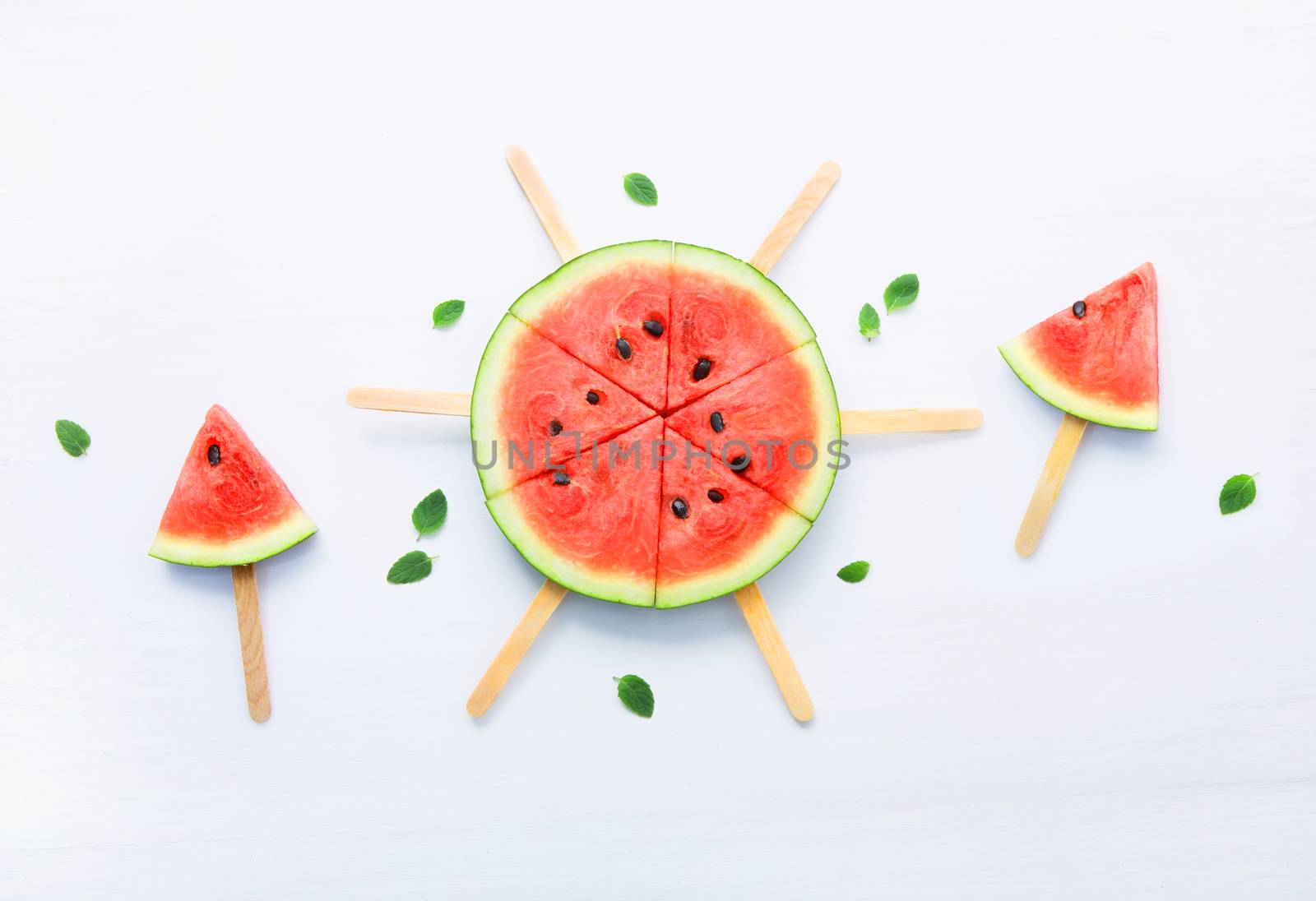 Fresh and sweet watermelon slice popsicles on white background by Bowonpat