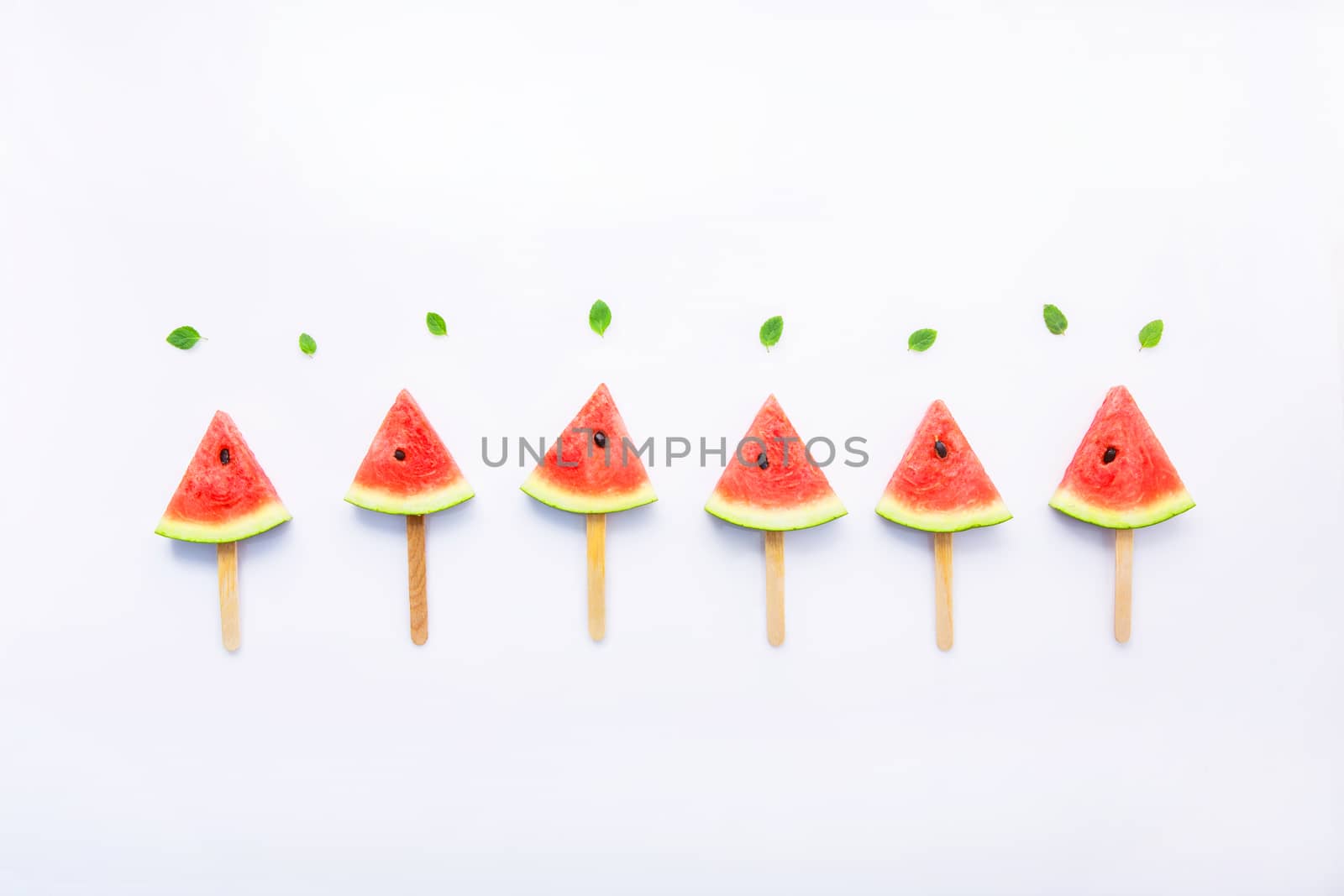 Fresh and sweet watermelon slice popsicles on white background by Bowonpat