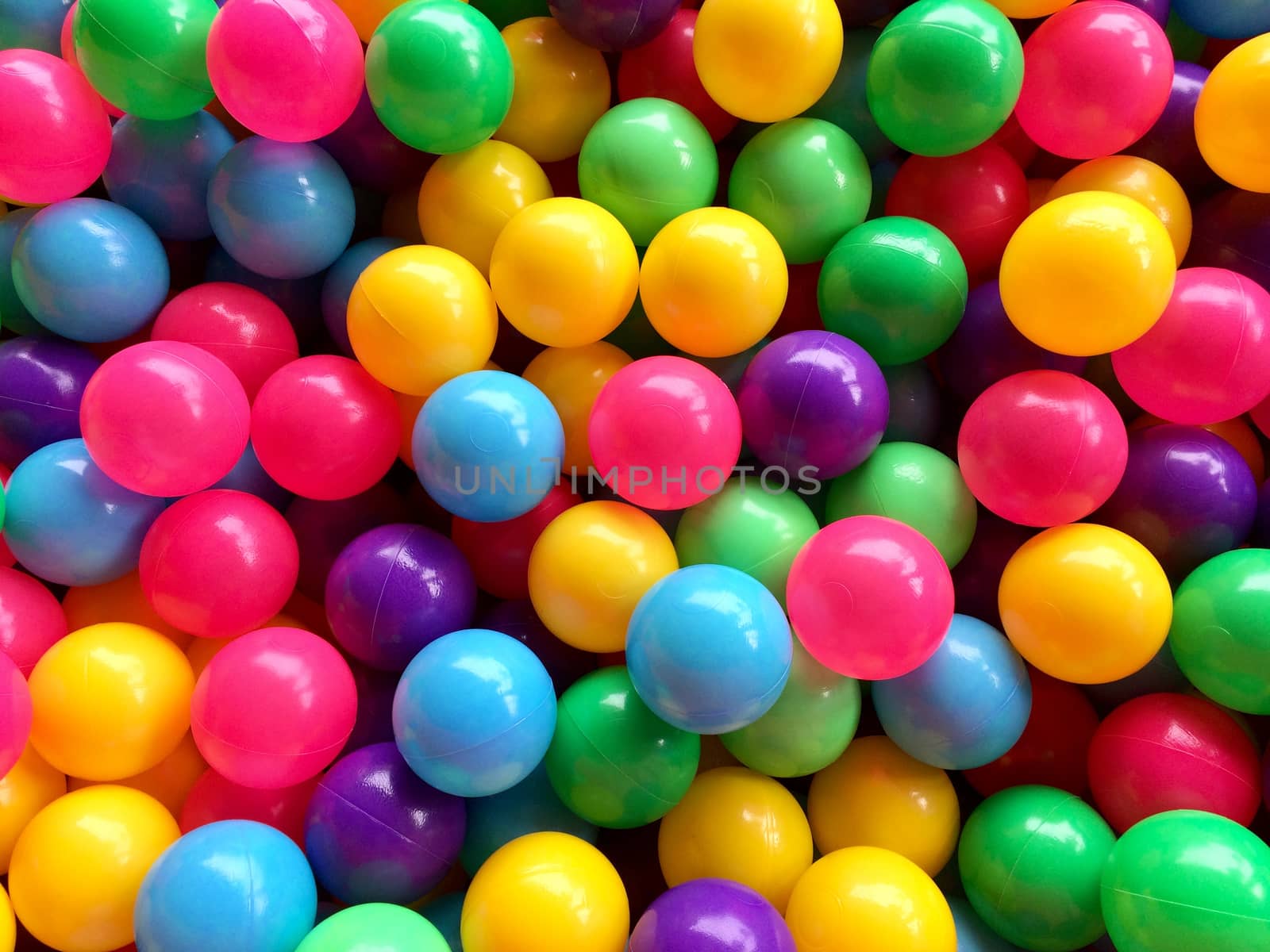 dry children's pool with colorful balls by Bowonpat