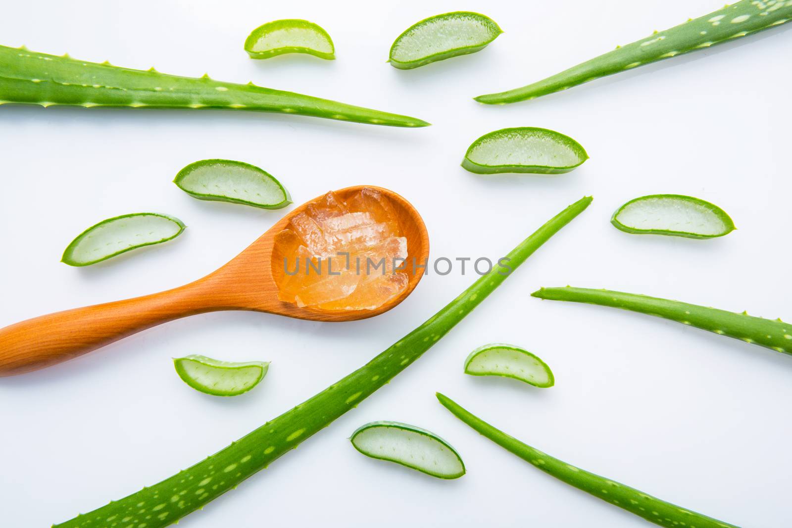 Aloe vera fresh leaves with aloe vera gel on wooden spoon. isola by Bowonpat