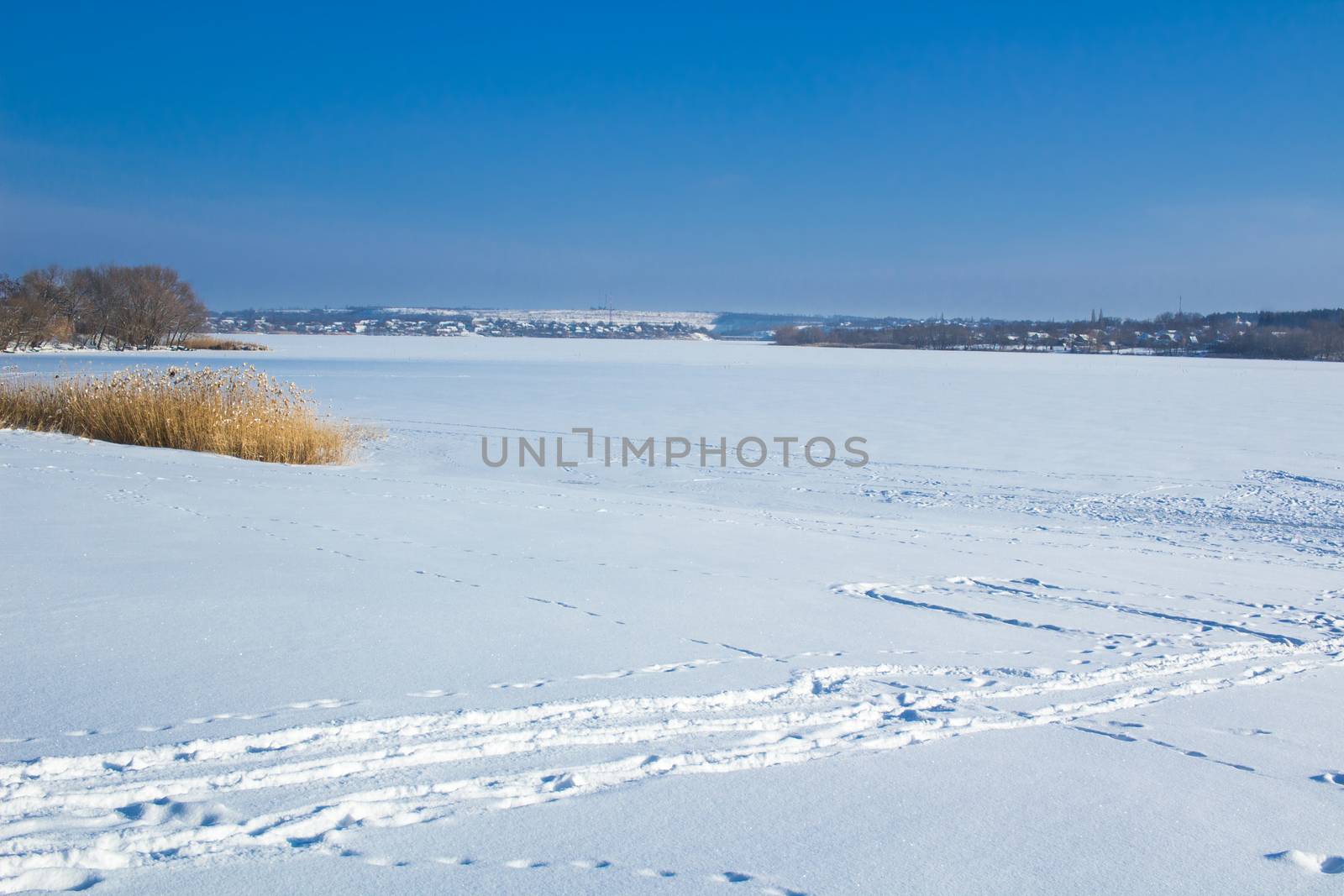 Winter paysage landscape of frozen lake river under snow
