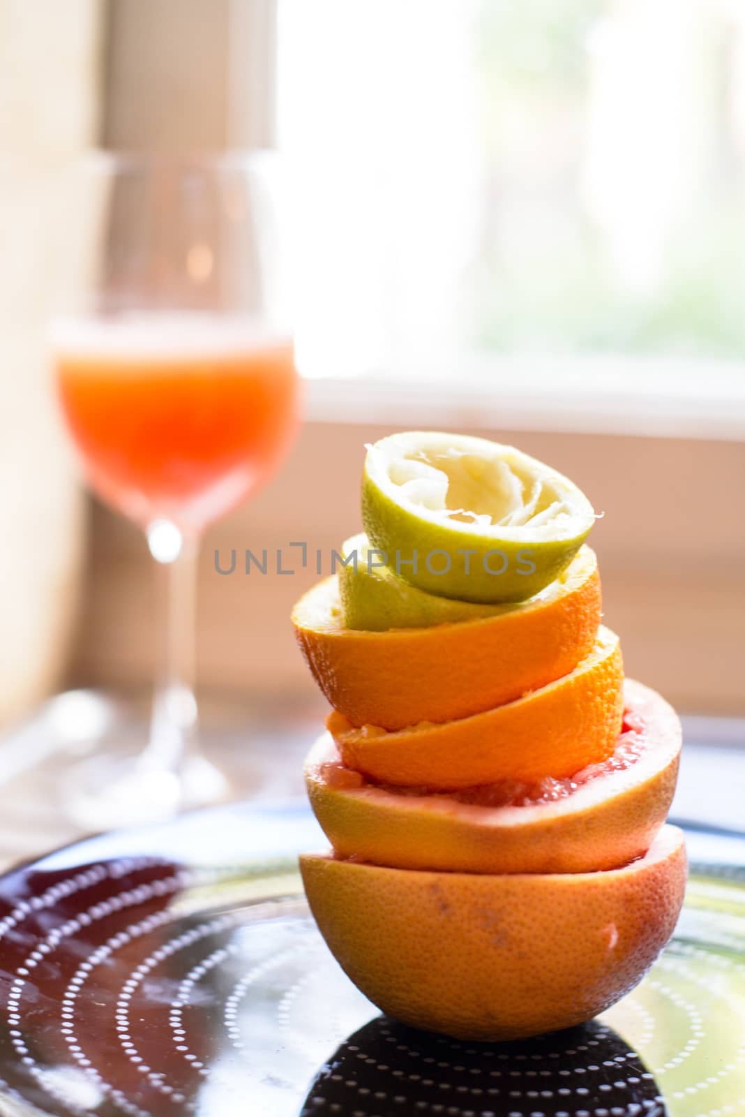 citrus fruit squeezed in the kitchen stacked peels to form a tower, citrus juice vitamin