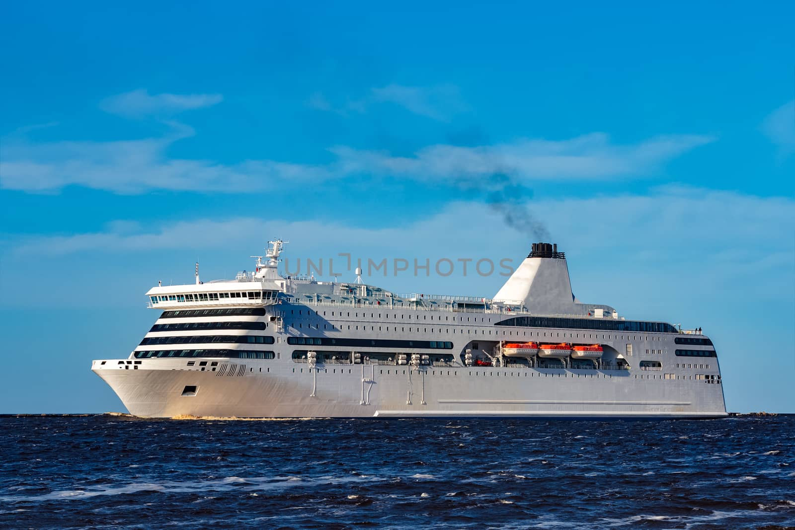 White cruise liner sailing on a clear day