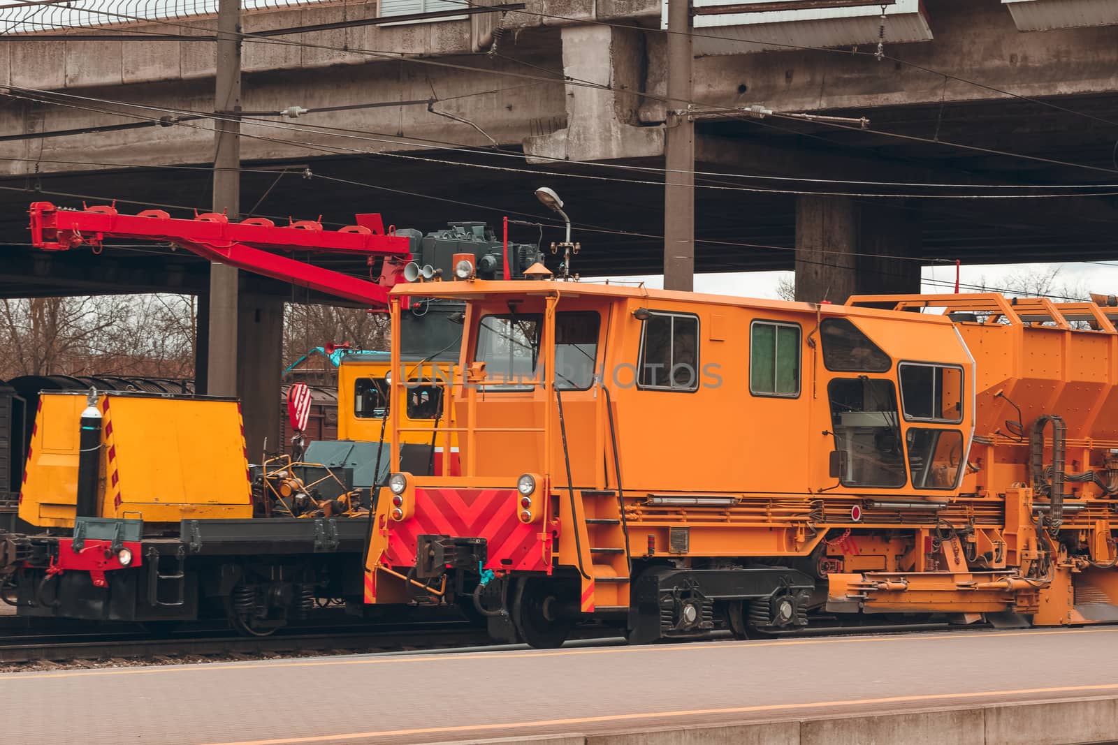 Ballast distributing and profiling track machine. Repair train