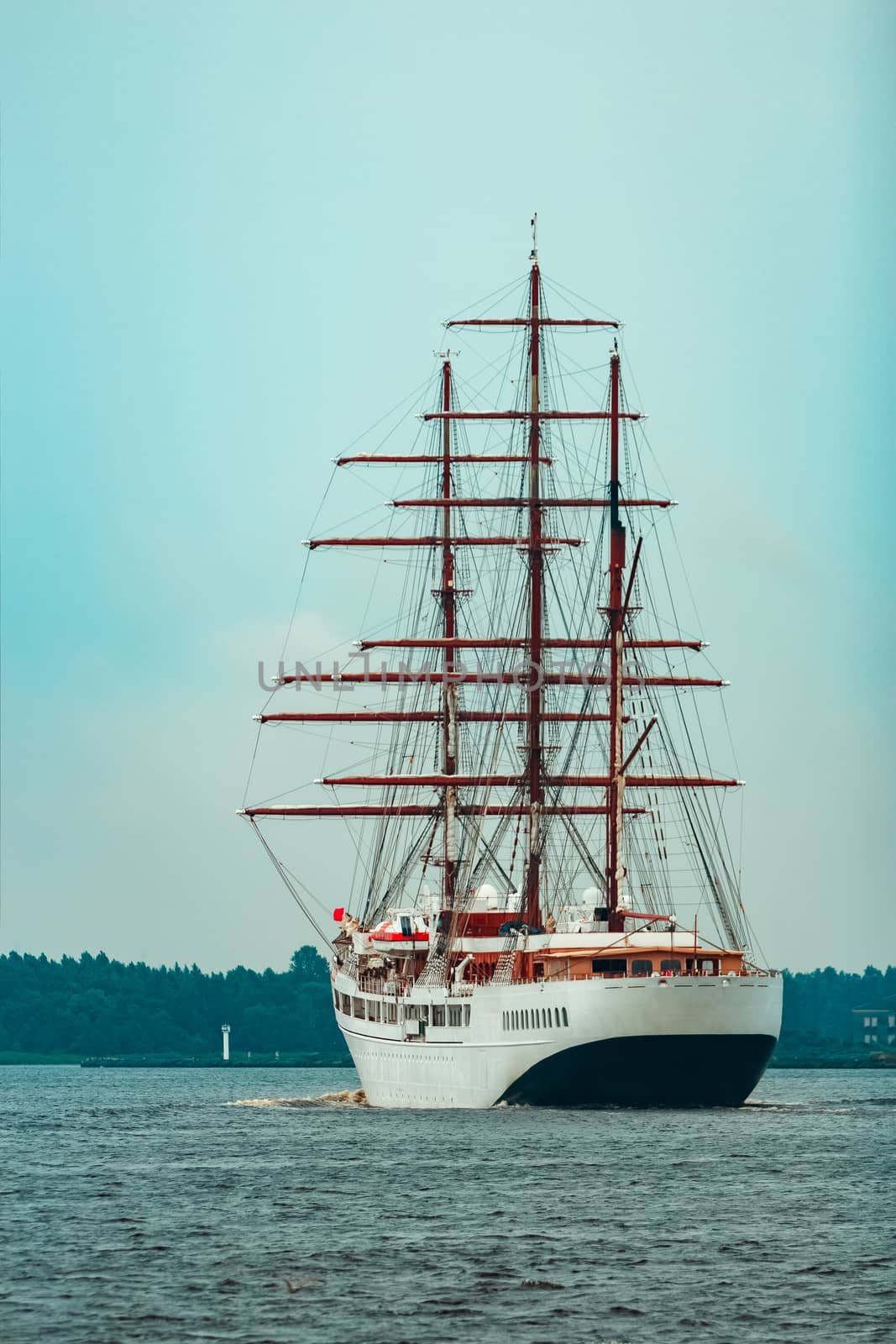 Big white sailing ship with three mast moving to the Riga port