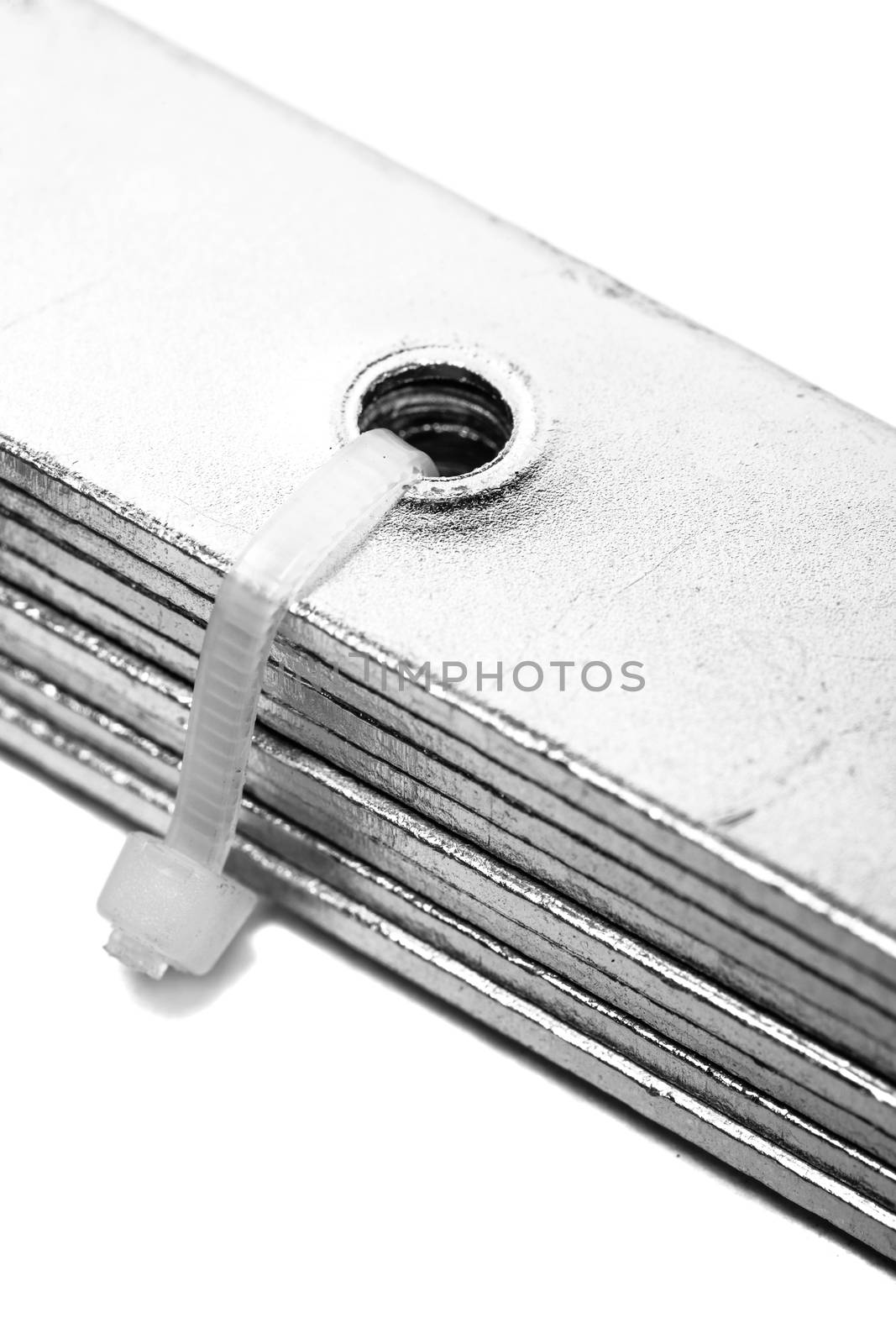 group of metal fixators fixed with plastic zip, isolated on white background