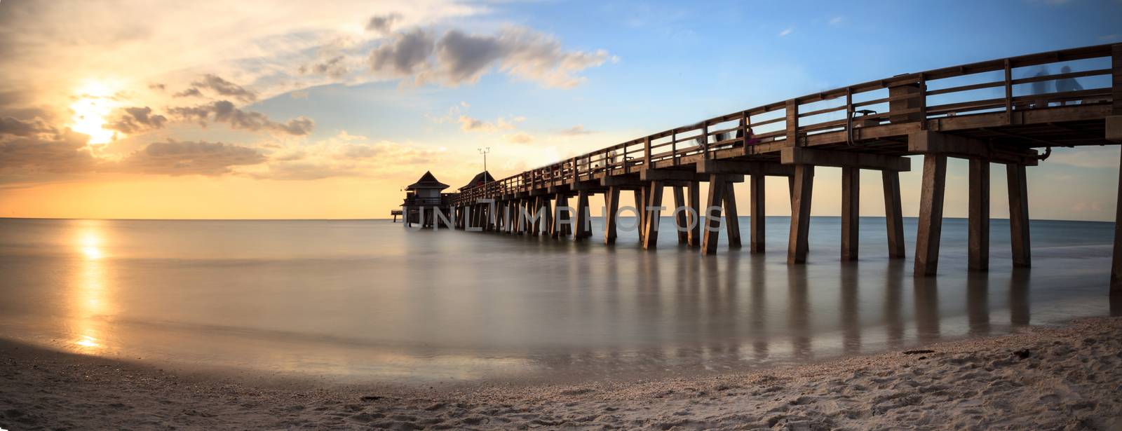 Naples Pier on the beach at sunset in Naples, Florida, USA