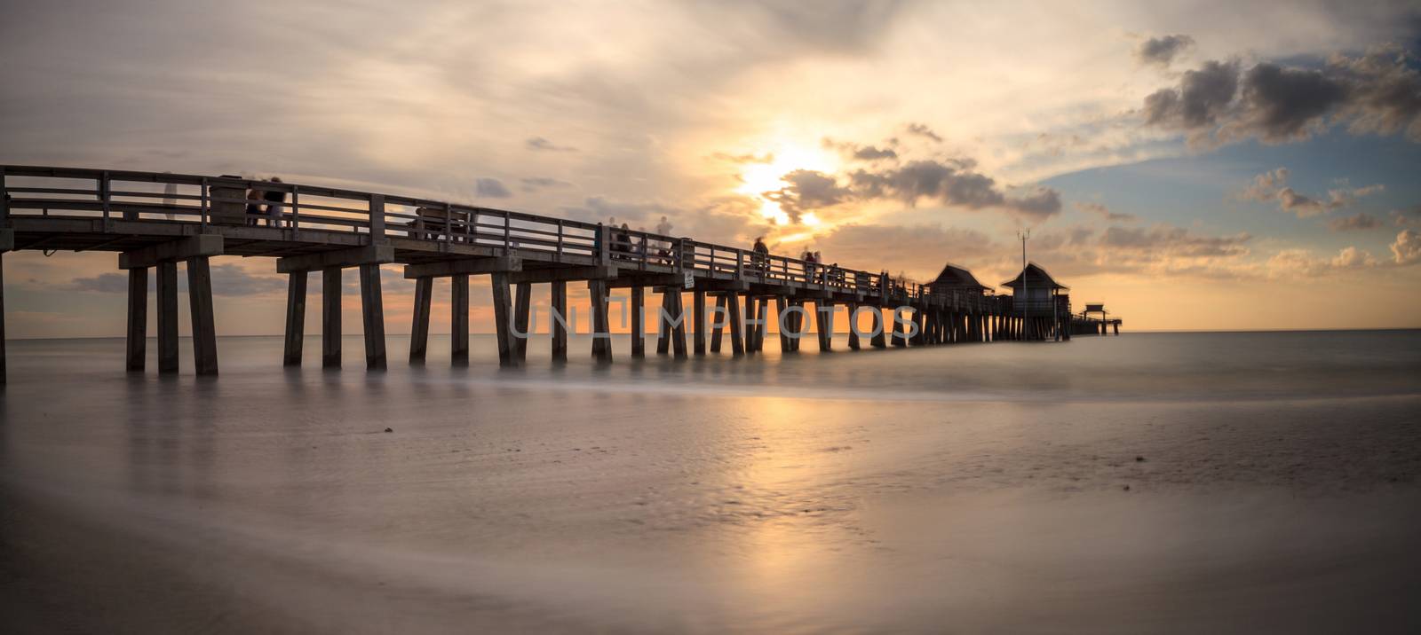 Naples Pier on the beach at sunset in Naples, Florida, USA