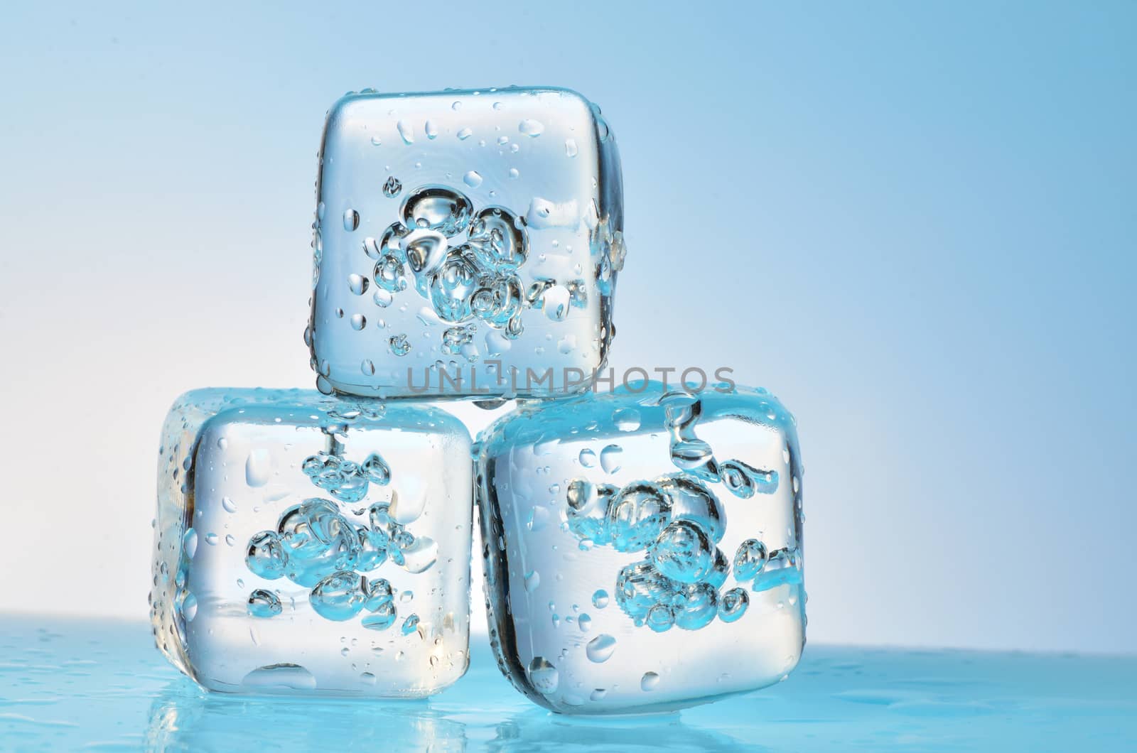 frozen ice cubes isolated on glass