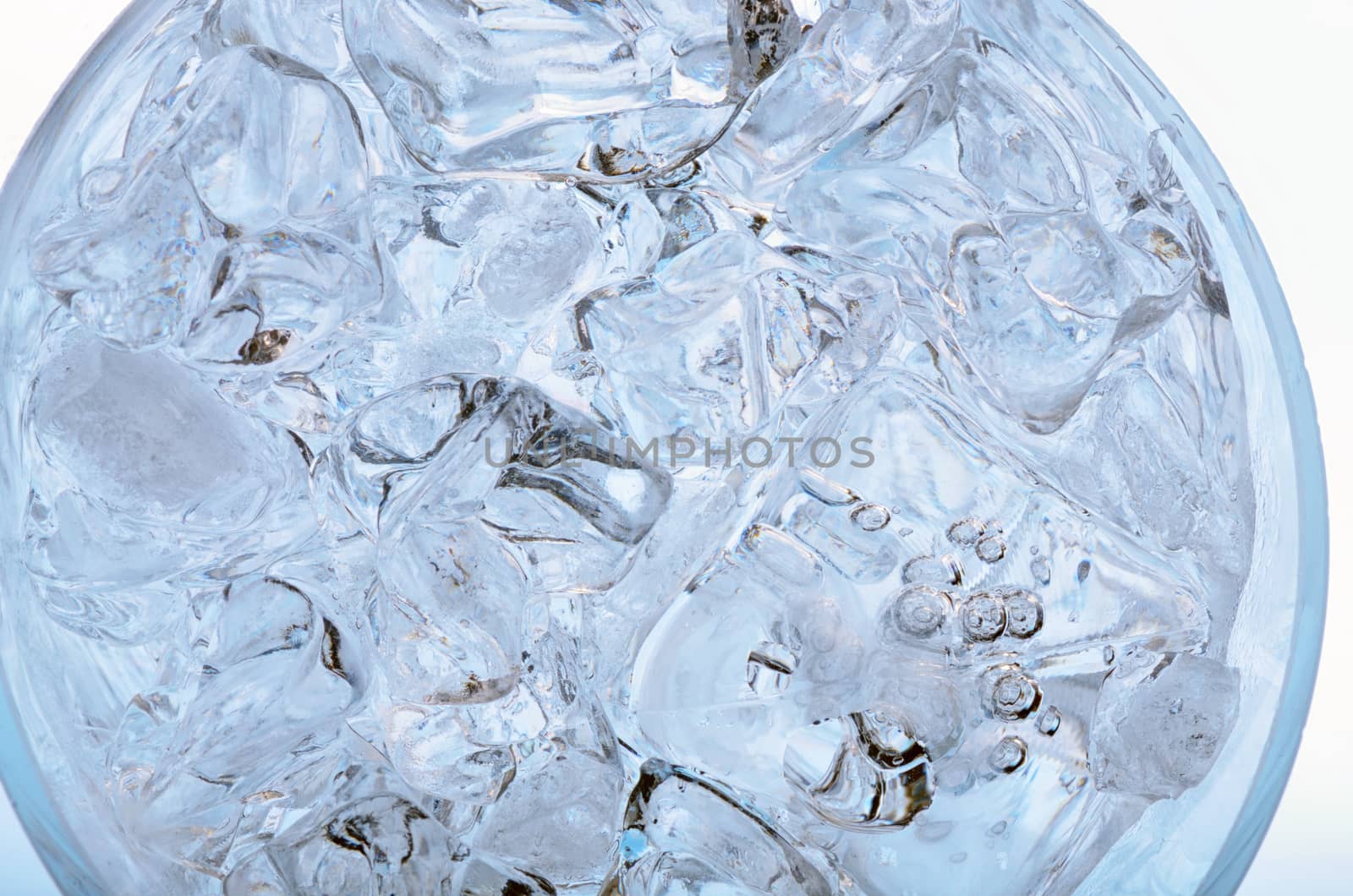 Glass with frozen ice cubes isolated  by jordachelr