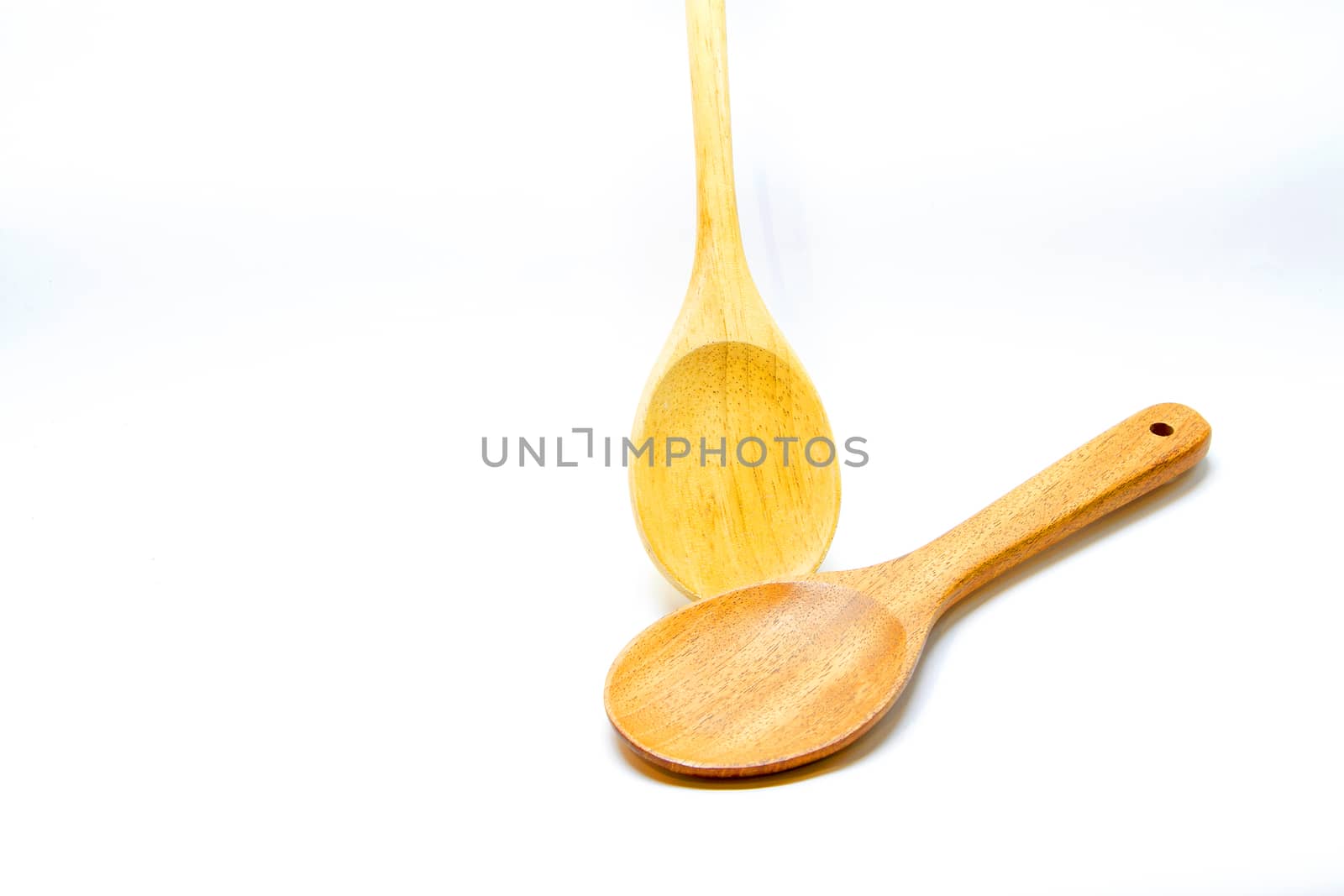 Two Brown wooden spoon on white background by TakerWalker