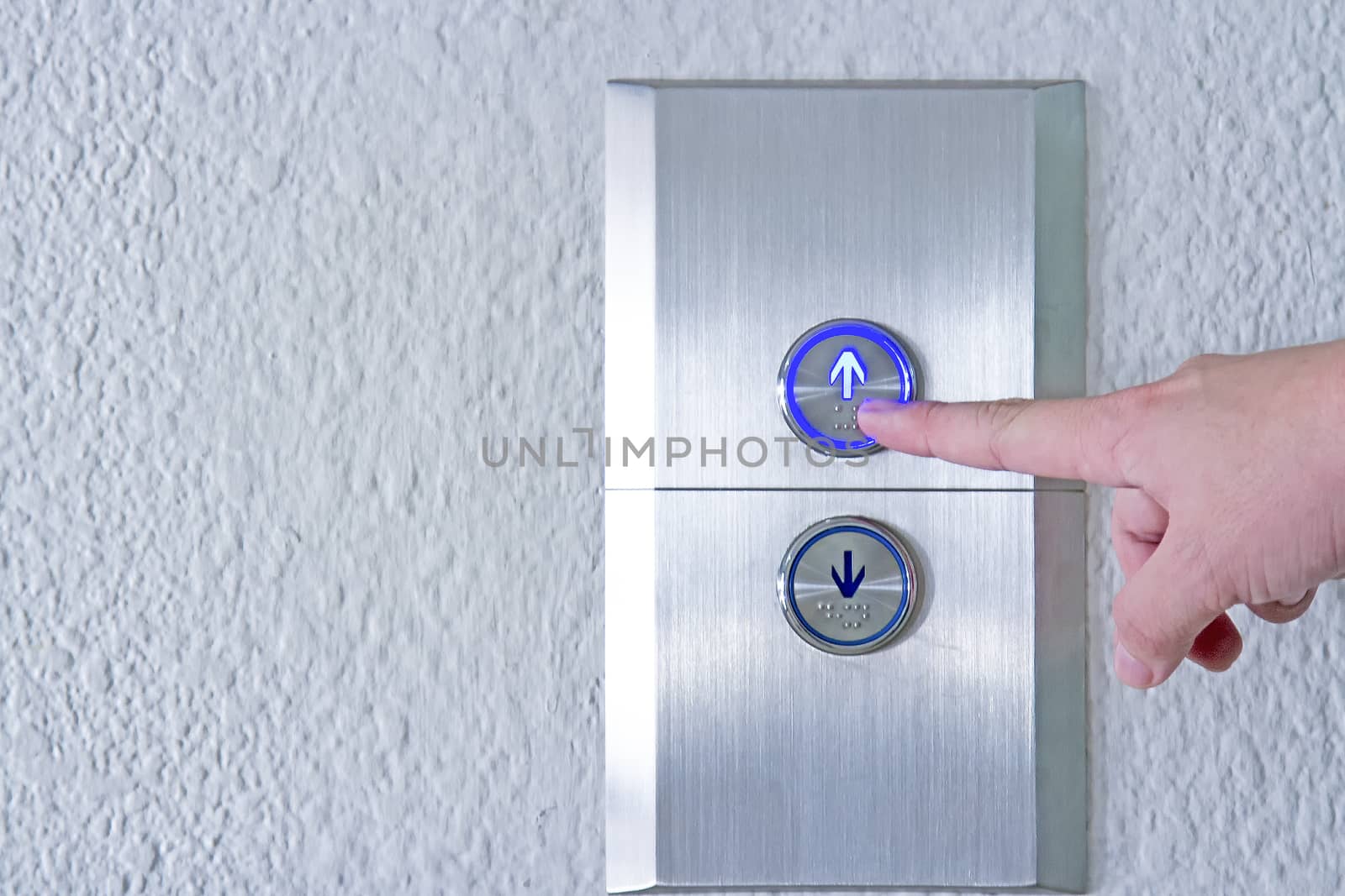 Using hands, press the elevator up and keypad elevator and bottom key