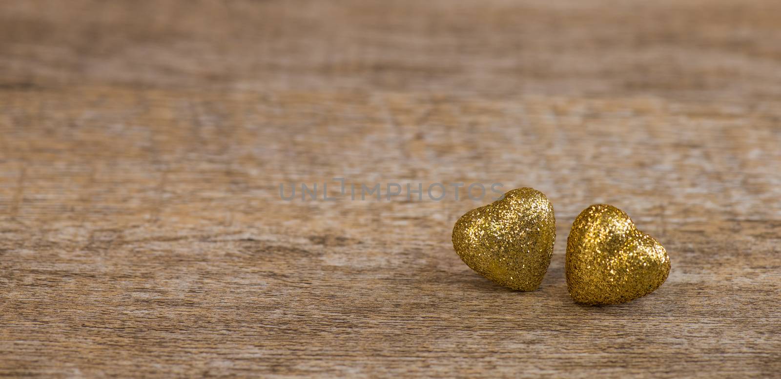 Love hearts on wooden texture background for Valentines Day Background, golden heart