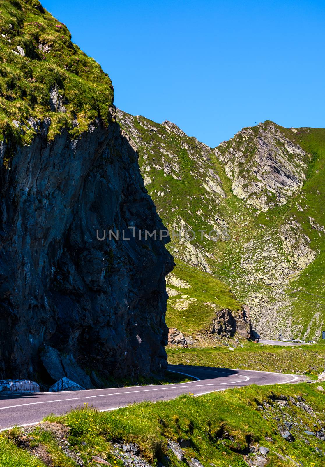 road under the cliff in high mountains by Pellinni