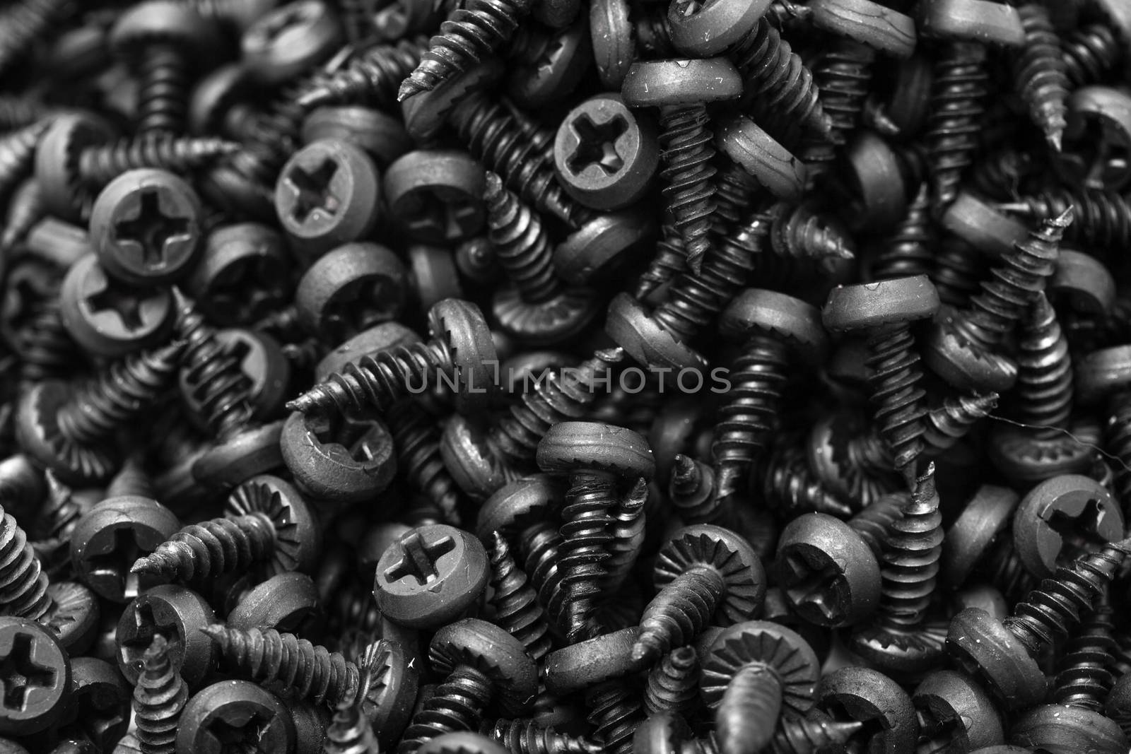 group of black screws for fixing metal profiles