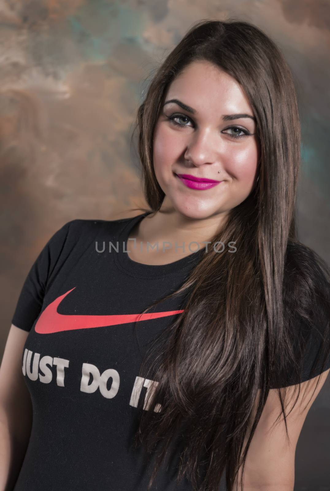 beautiful young woman in her 20's in a close-up portrait in studio