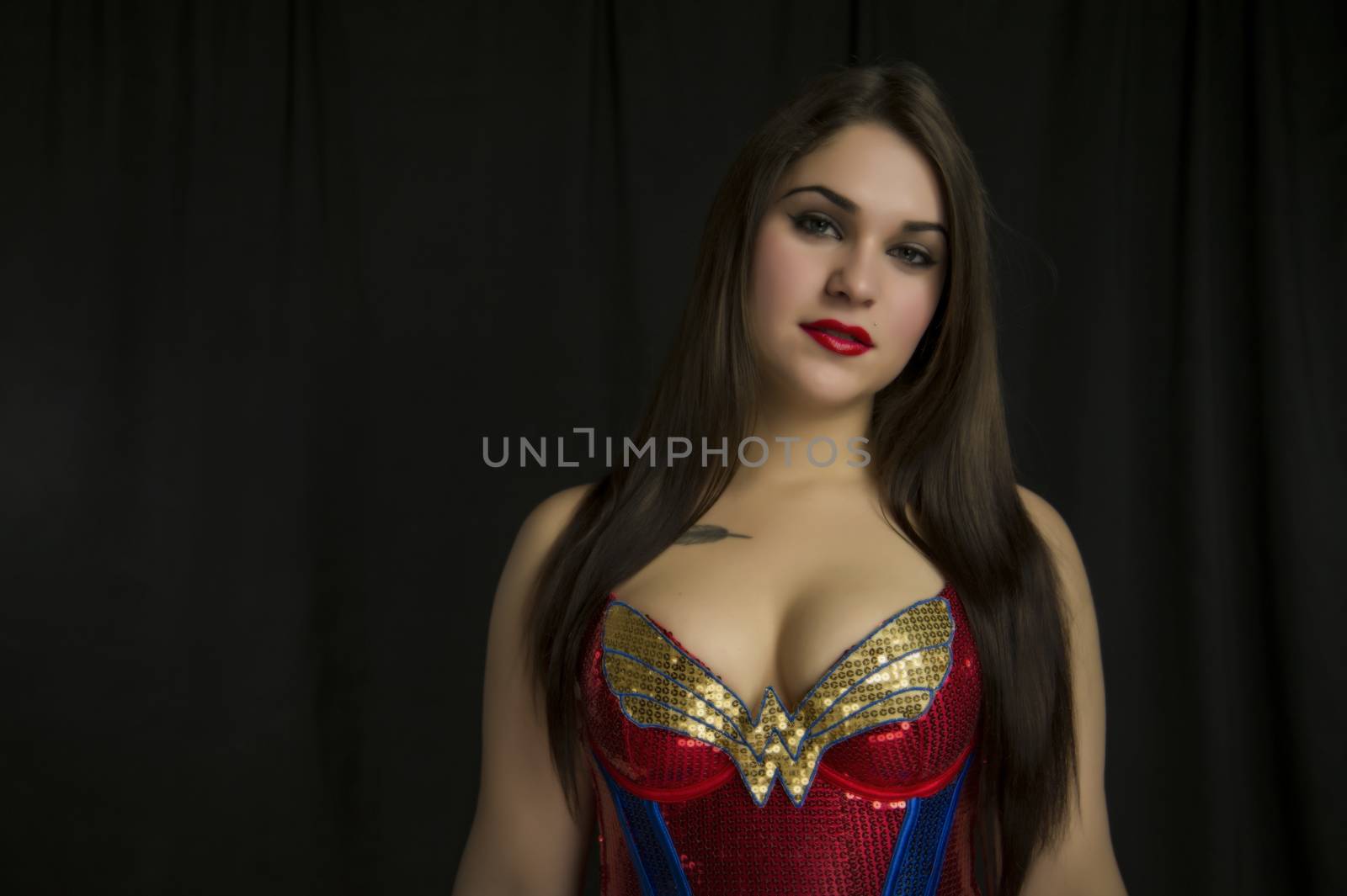 beautiful young woman in her 20s in a close-up portrait in studio