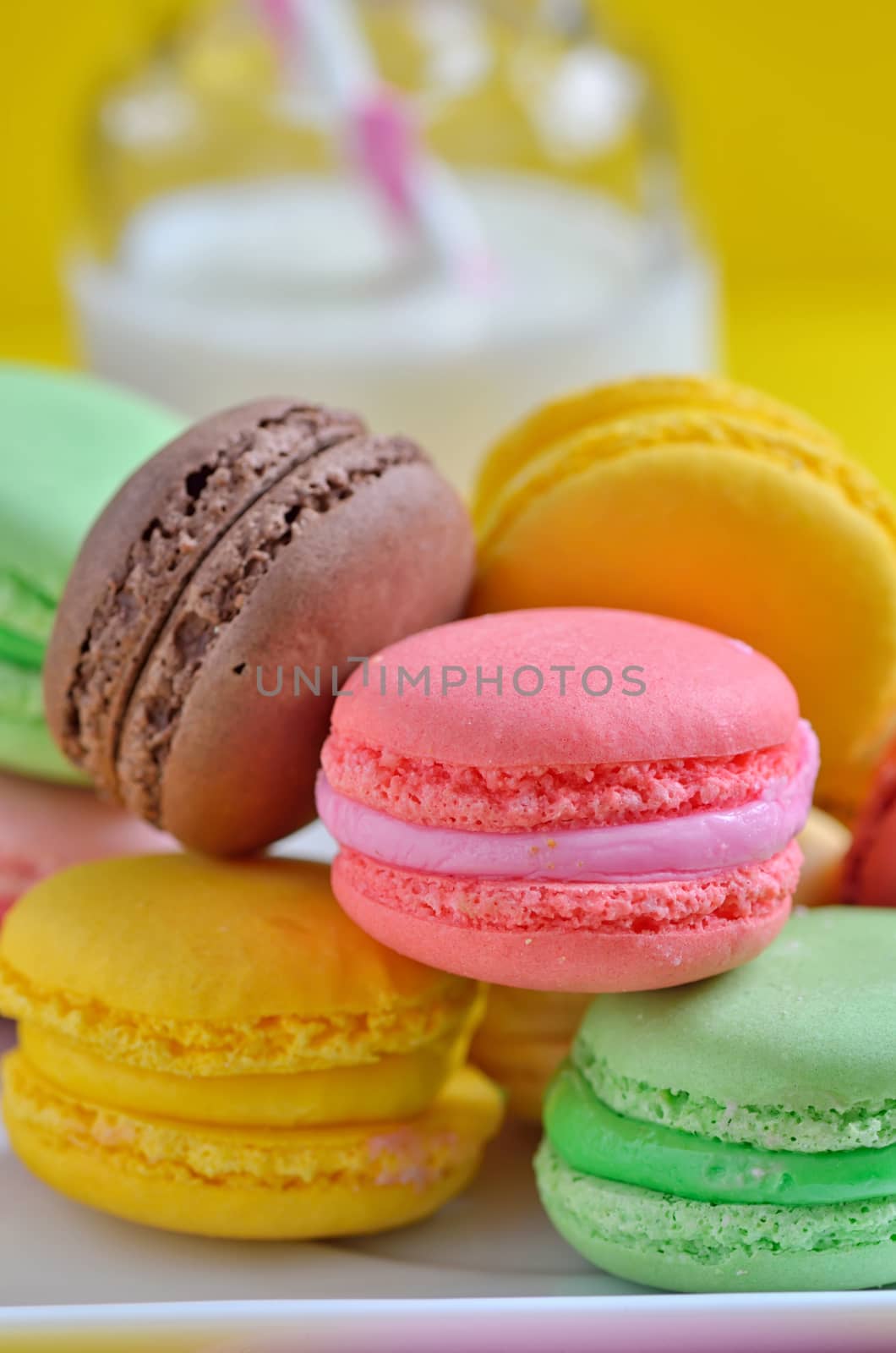 Tasty Colorful macaroons on plate by mady70