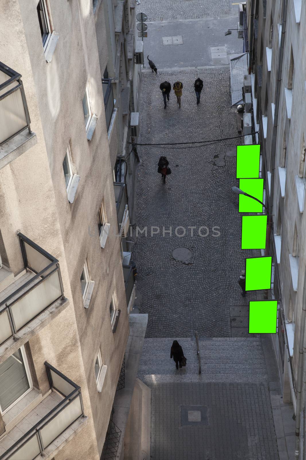 A tiny alley with billboards executed in green from above.
