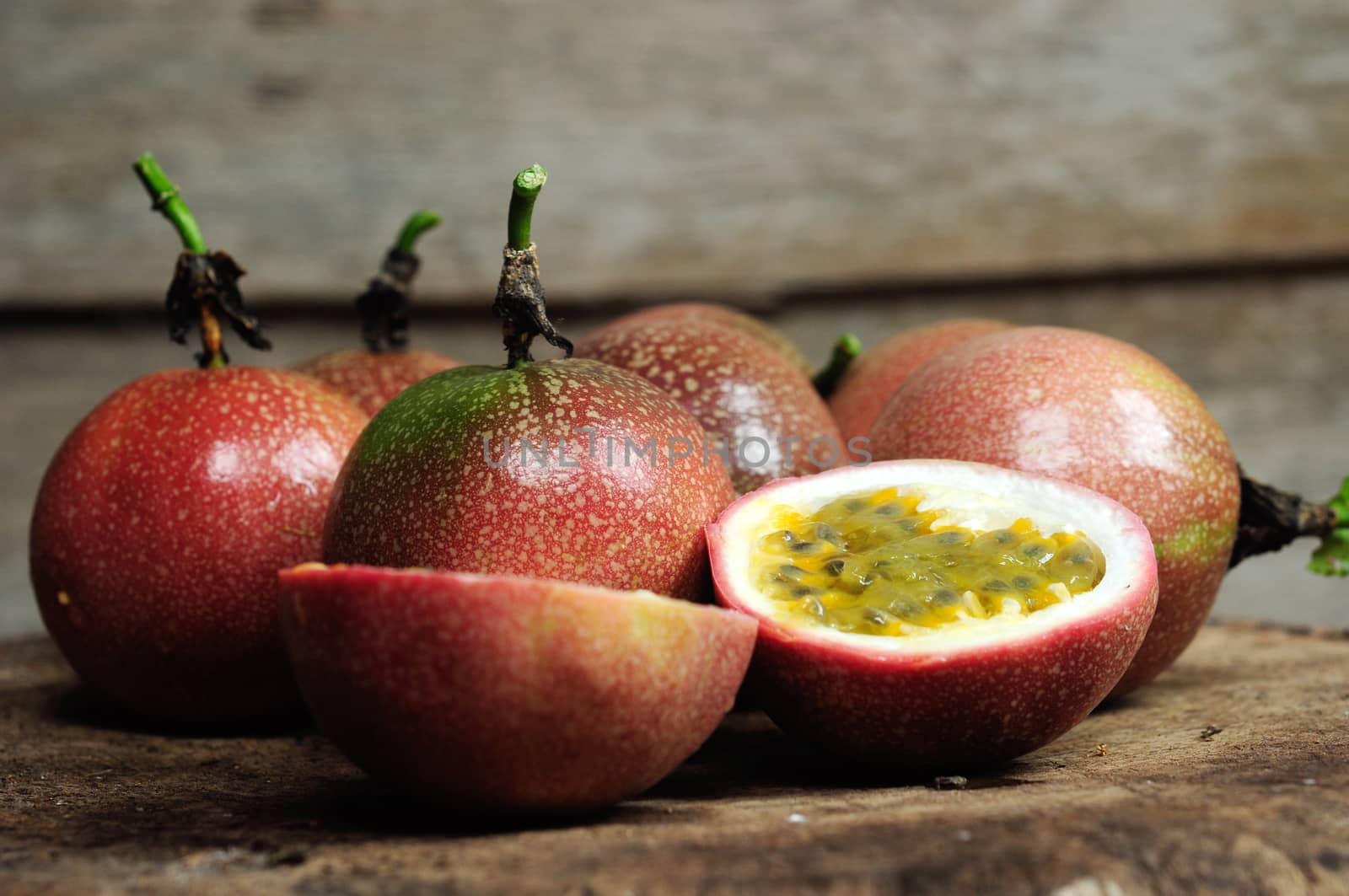 Passion fruit on old wooden table.