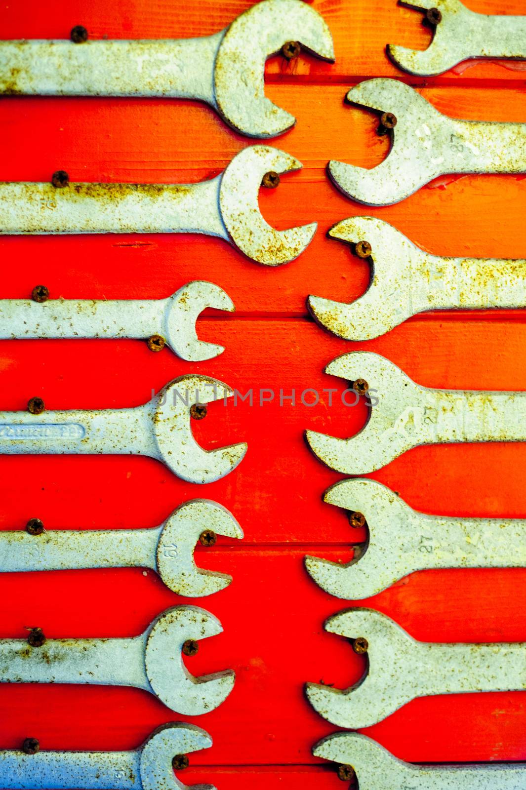 old and used english keys on red background