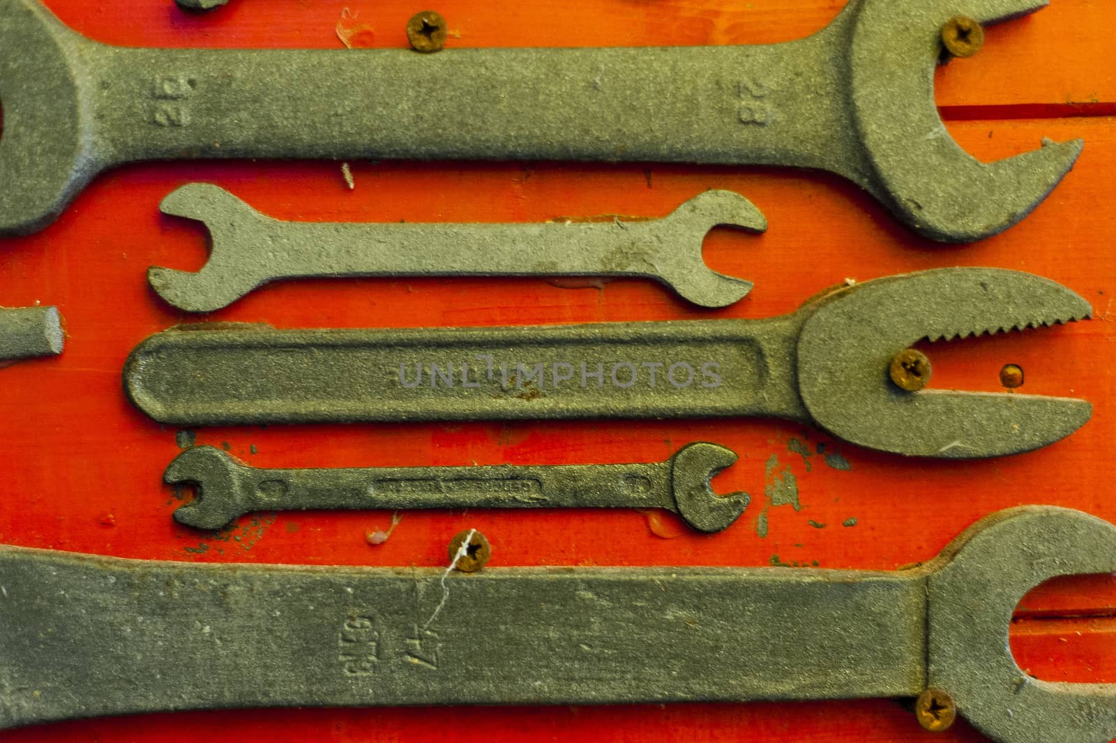 old and used english keys on red background