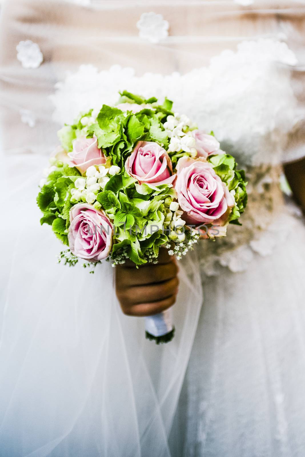 bridal bouquet with white and pink and green flowers, hydrangeas, roses