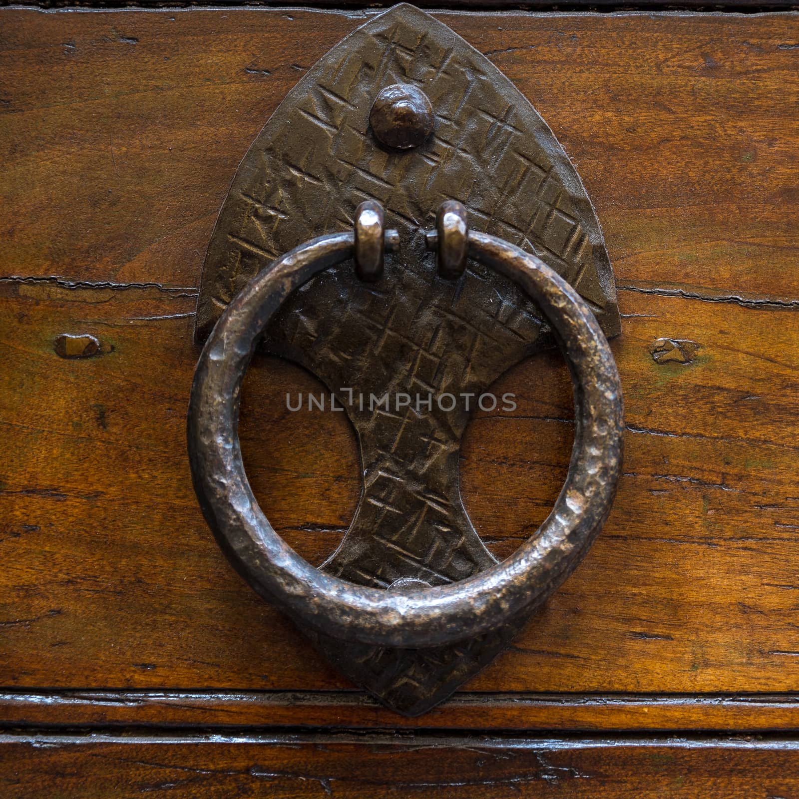 Close up of rustic old door in Spoleto, Italy.