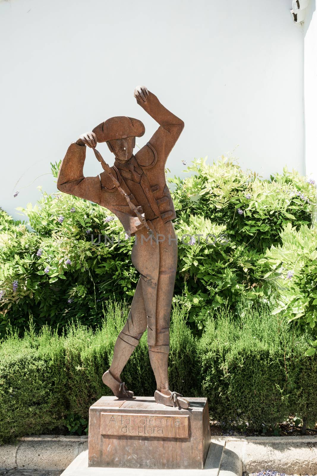 A bull fighter matador statue in the city of of Ronda Spain, Europe on a hot summer day with clear blue skies