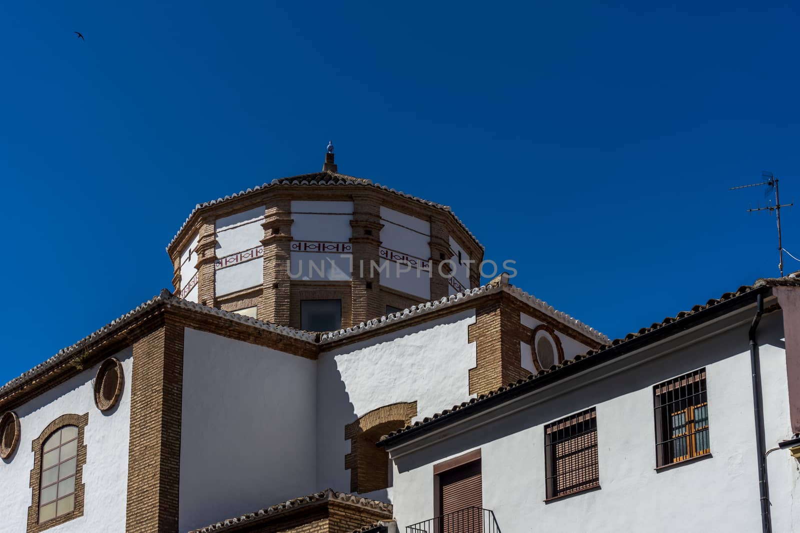 A church in the city of of Ronda Spain, Europe on a hot summer day with clear blue skies