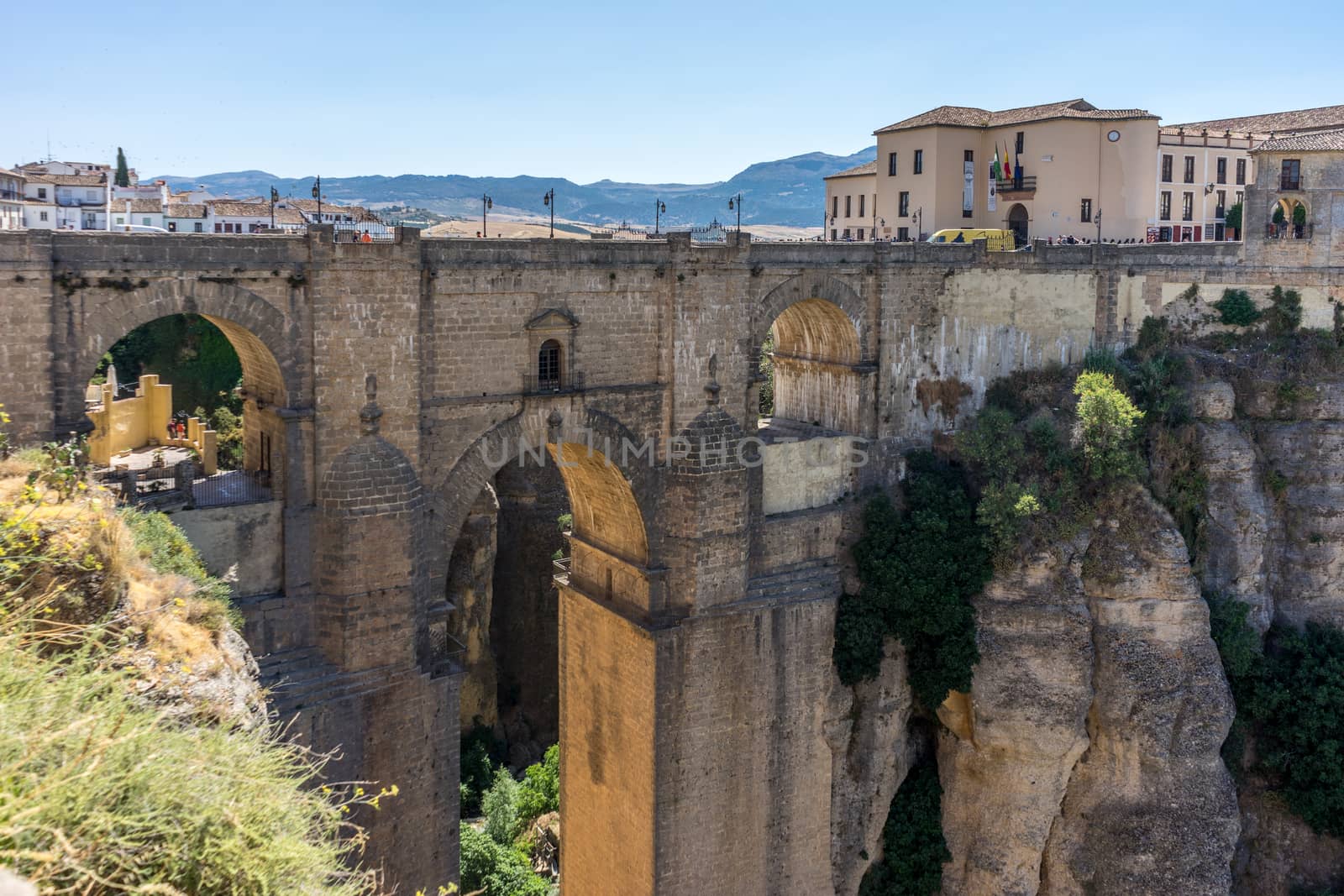 A gorge in the city of Ronda Spain, Europe on a hot summer day with clear blue skies