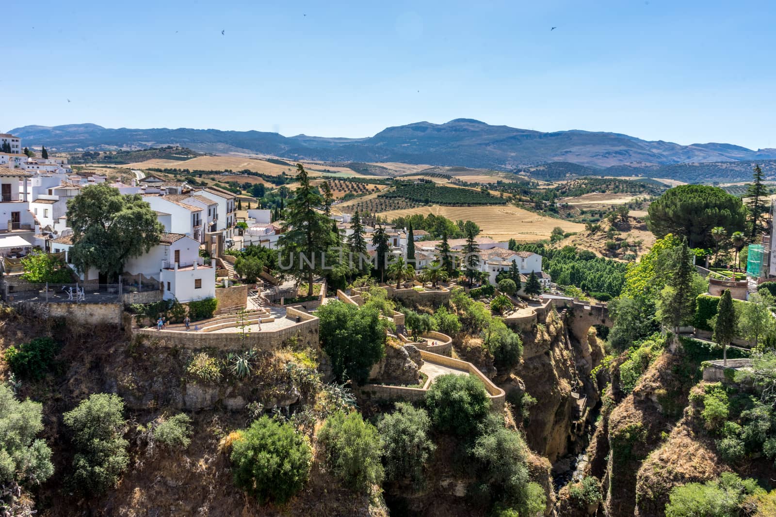 A gorge in the city of Ronda Spain, Europe on a hot summer day with clear blue skies