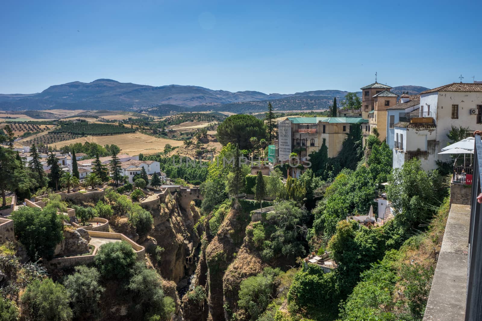 A gorge in the city of Ronda Spain, Europe on a hot summer day with clear blue skies