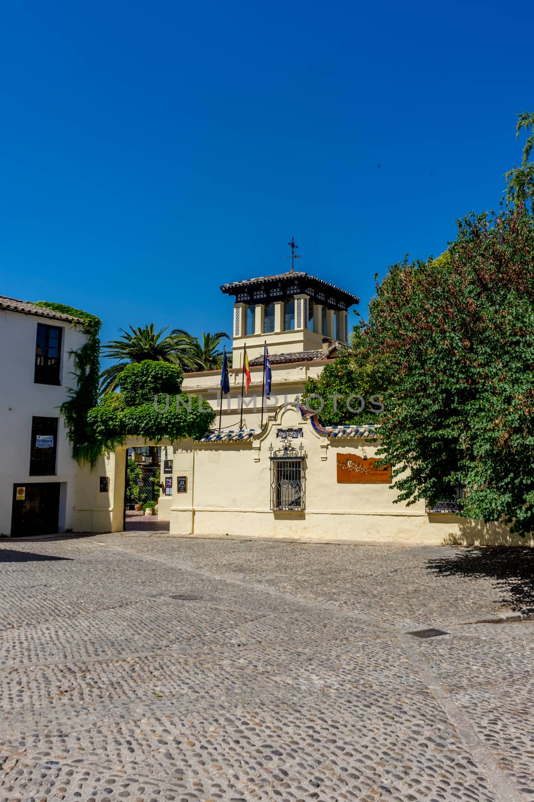 A church in the city of Ronda Spain, Europe on a bright hot summer day with clear blue skies